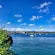 Sosúa Bay in Dominican Republic with anchored boats and a coastline with coastal buildings and short hills